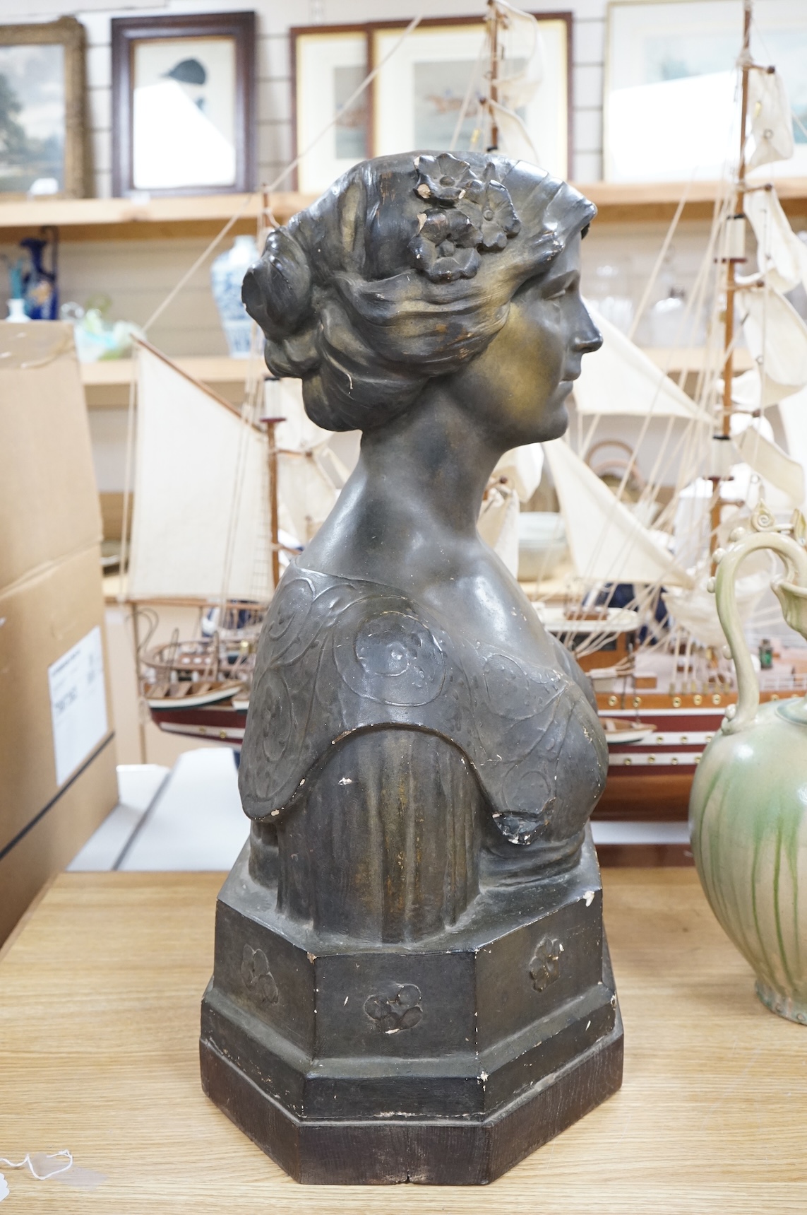 An early 20th century bronzed plaster bust 